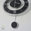 تصویر ساعت دیواری فلزی با پاندول ثابت